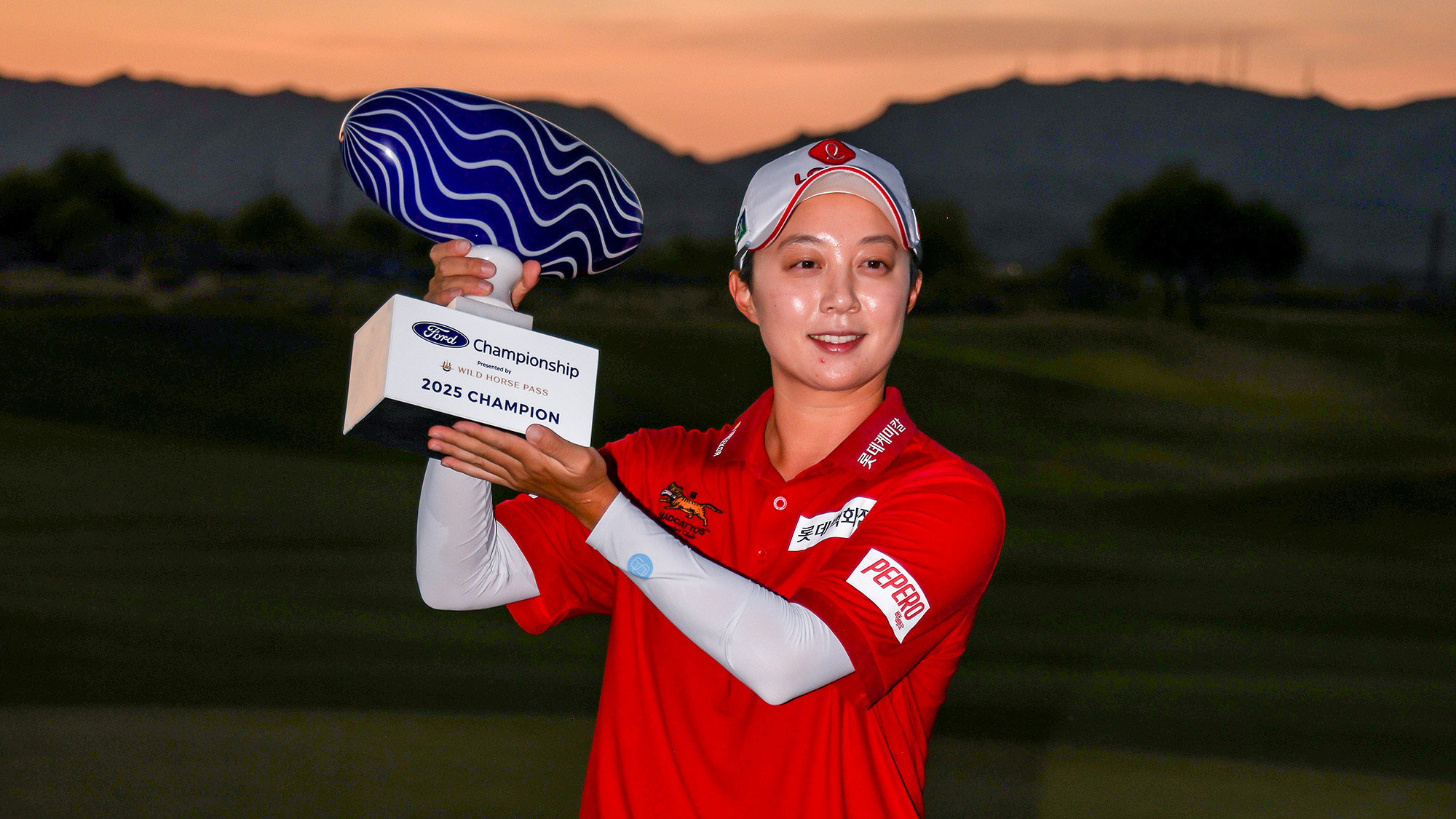 Hyo Joo Kim of South Korea celebrates with the trophy after winning the Ford Championship presented by Wild Horse Pass 2025 during the final round at Whirlwind Golf Club in Wild Horse Pass on March 30, 2025 in Phoenix, Arizona.